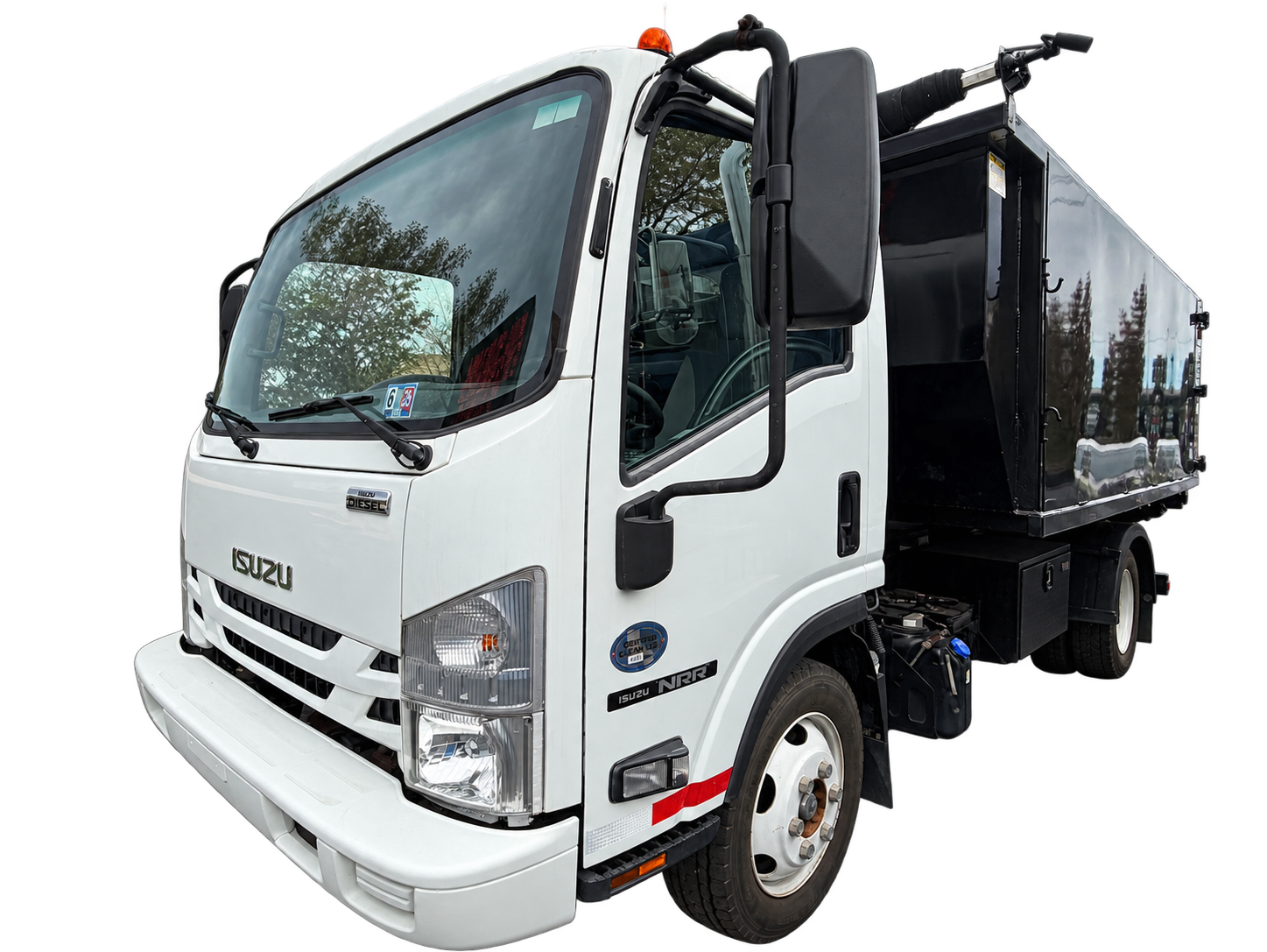 José’s Isuzu truck with the Junk Smash container